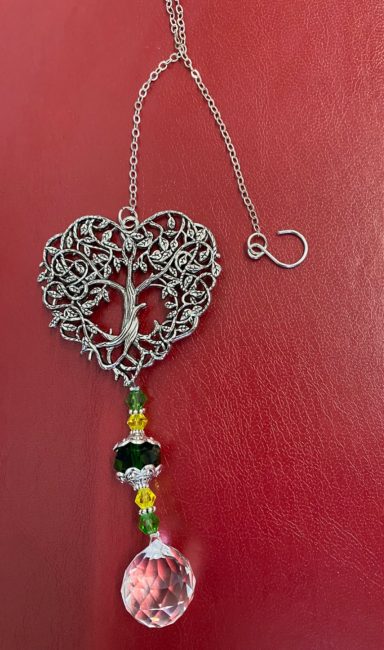 Silver heart pendant with a tree design, adorned with colourful beads and a crystal drop.